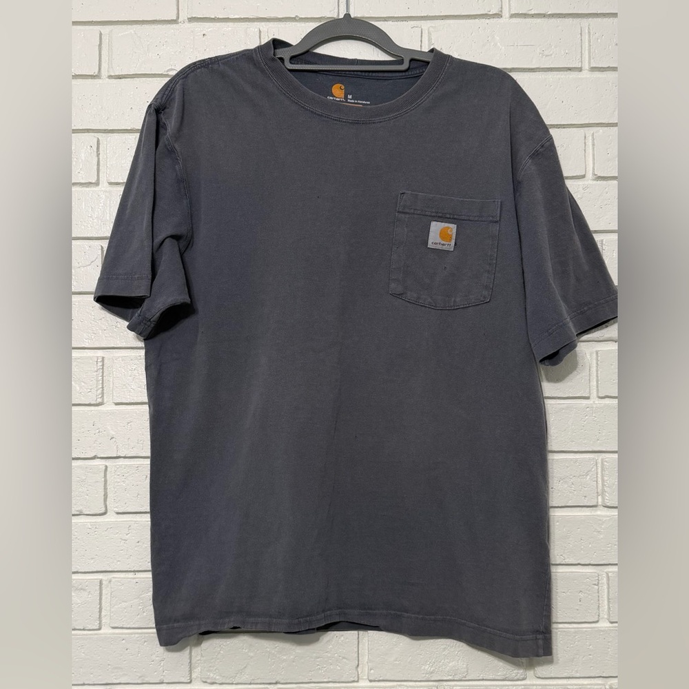 Men’s Carhartt tee. Pocket. Size Medium. Small pin holes. See pics
